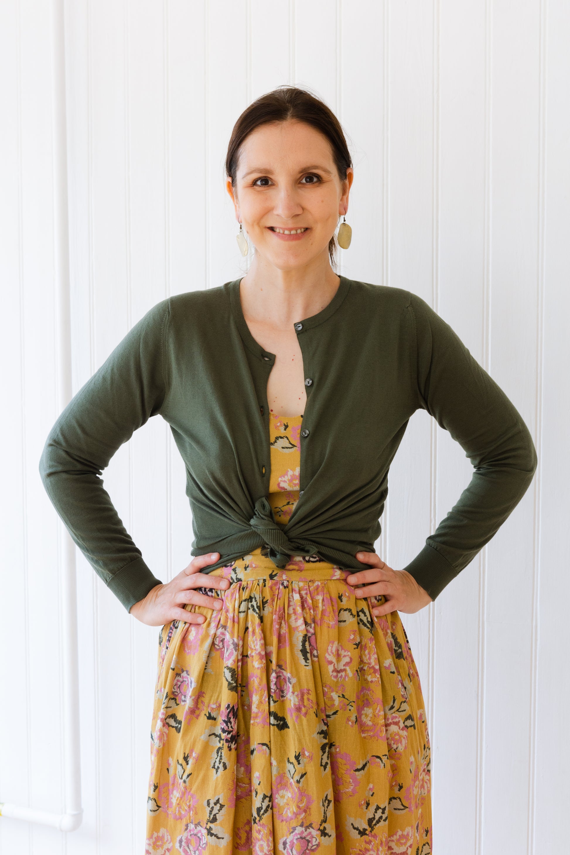 Vintage inspired midi length summer dress styled with cardigan knotted in 1950's style.