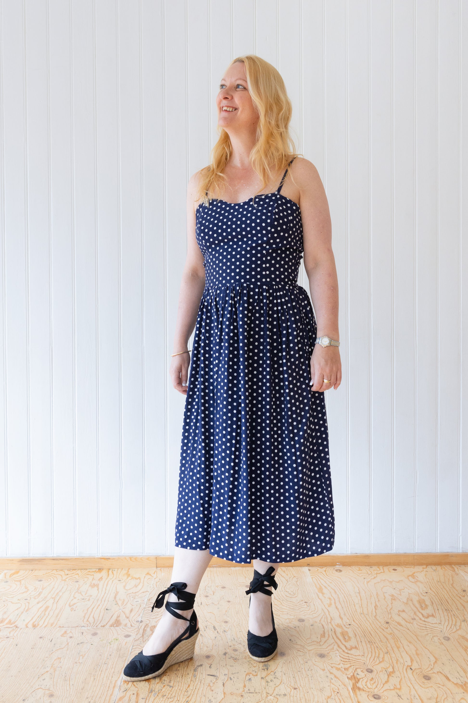 Blue and white polka dot vintage inspired midi length dress with fitted bodice, gathered skirt and rouleau straps.