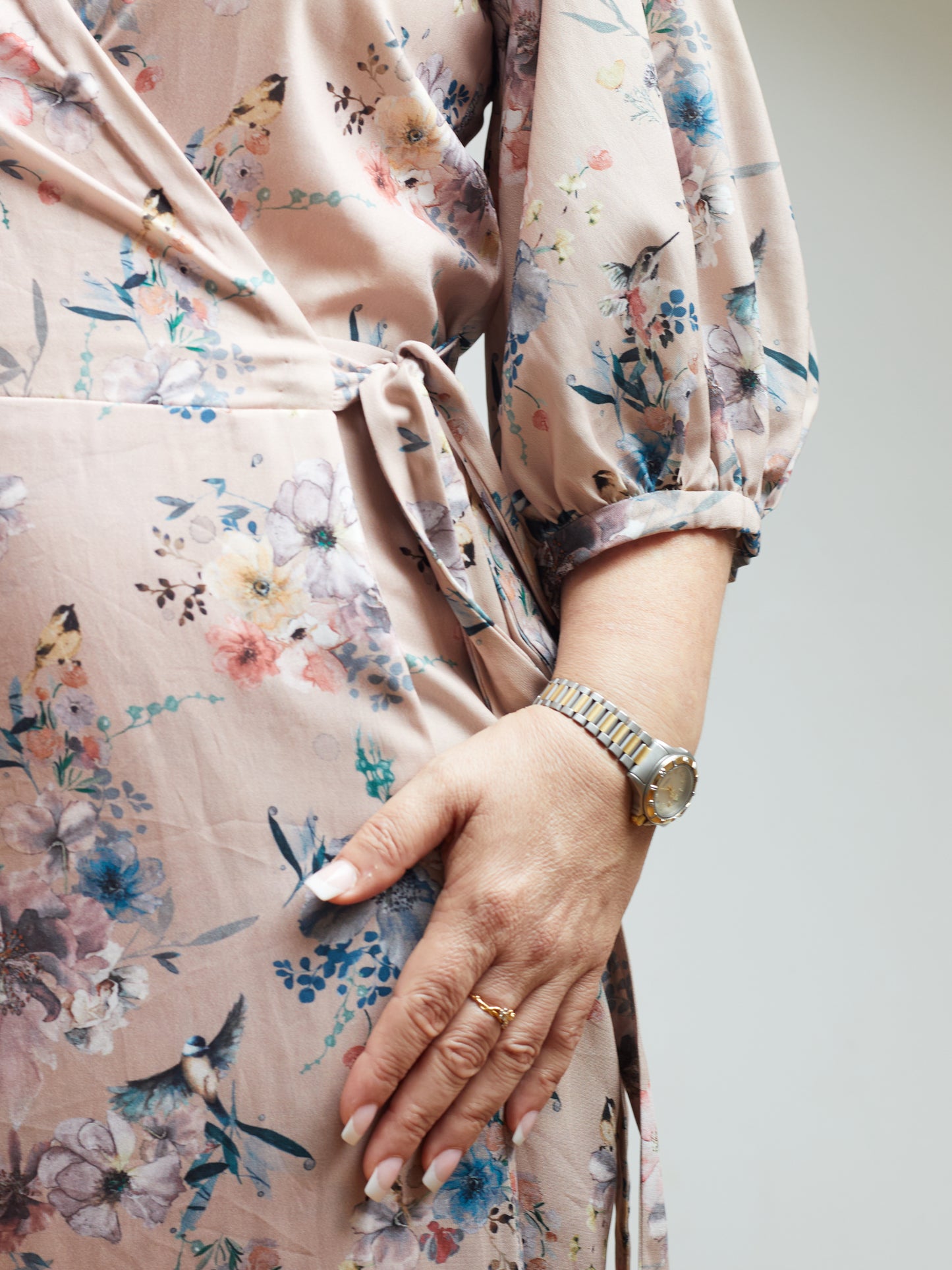 Close up of tie detail featuring on a vintage inspired wrap dress.