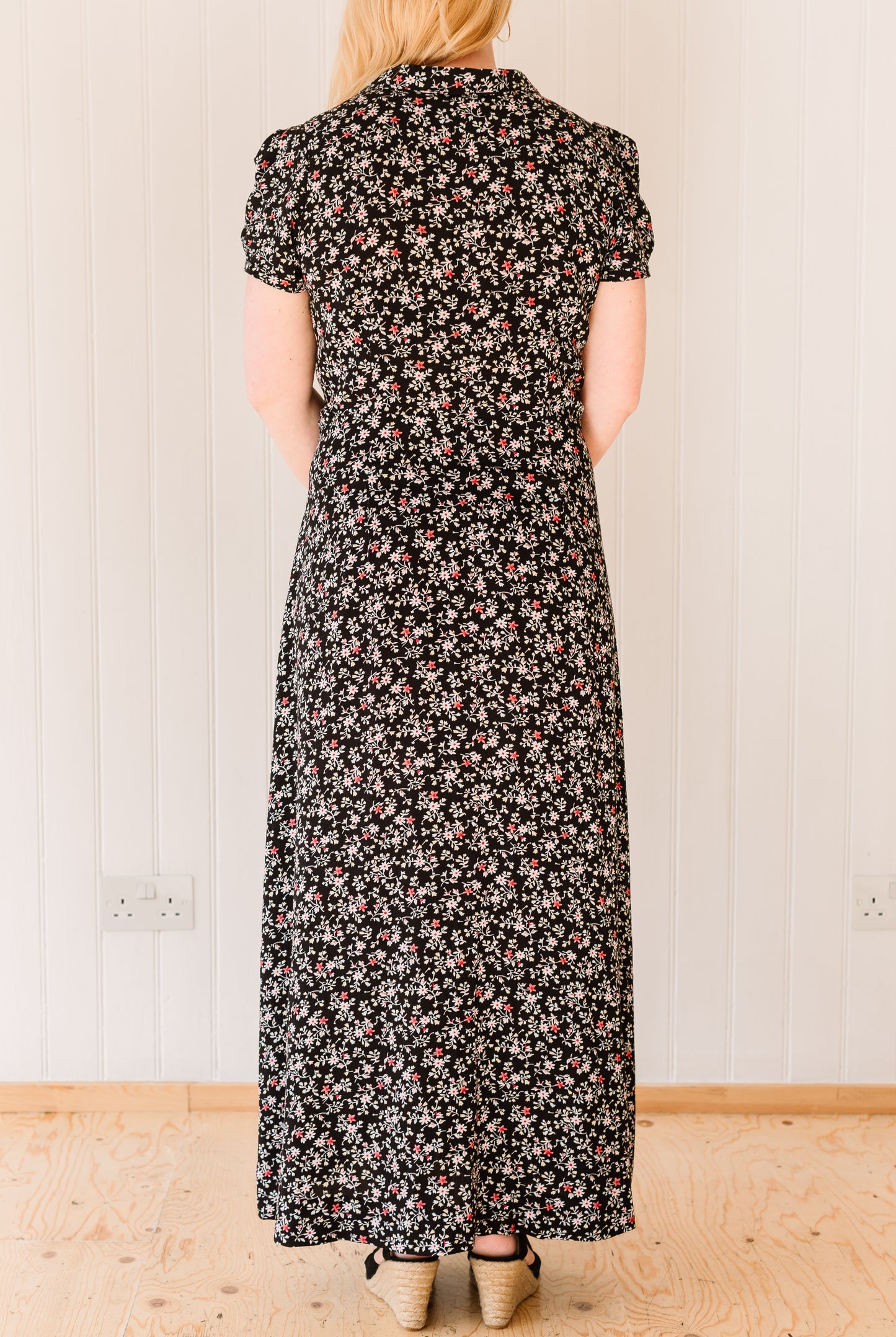 Back view of vintage inspired maxi dress in a floral material.